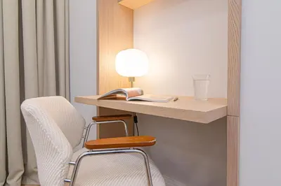 a room with a desk with a chair and a book at #stayhere - Authentic & Artsy Studio in Heart of Vilnius Old Town in Vilnius