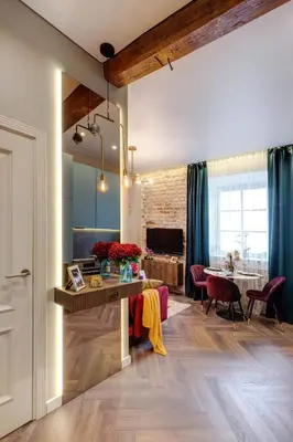 a living room with a table and a dining room at Charming apartment next to the Church of St Anne by Reside Baltic in Vilnius