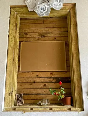 a picture of a mirror in a wooden frame at Authentic old studio house in Kaunas