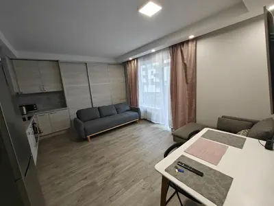 a living room with a couch and a table at Kavoliuko 14 in Vilnius