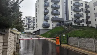 a flooded street in front of a building at Kavoliuko 14 in Vilnius