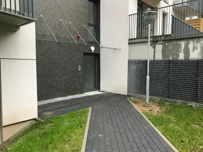 an empty alley with a door in a building at Near Ozas in Vilnius