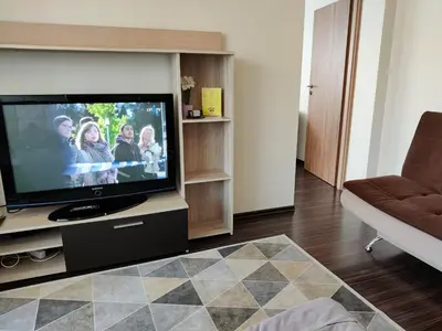 a living room with a flat screen tv at Apartments near BIG in Vilnius