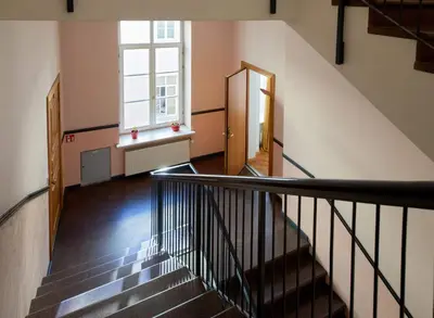 a staircase in a building with a window at ReHouse- Didzioji 39 in Vilnius