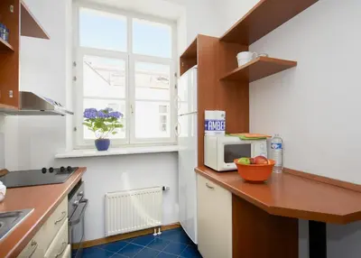 a kitchen with a counter with a microwave on it at ReHouse- Didzioji 39 in Vilnius