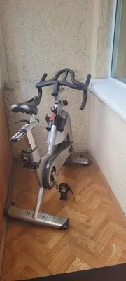 a exercise bike sitting in the corner of a room at Hostel 4 in Šiauliai