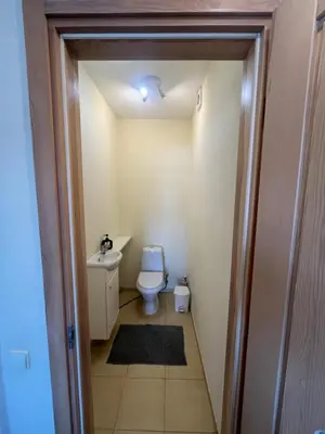 a small bathroom with a toilet and a sink at Apartments in the old town with an impressive view in Vilnius