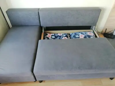 a couch with two pillows in a room at B23 Apartments in Vilnius