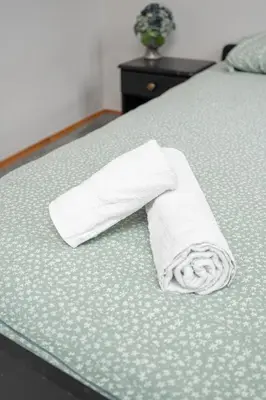 a roll of toilet paper sitting on a bed at Church through the window in Vilnius