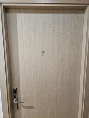 a wooden door with a knob on it at Kauno apartamentai Big bed in Kaunas