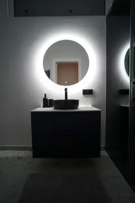 a bathroom with a sink and a mirror at Old Town apartment in Kaunas