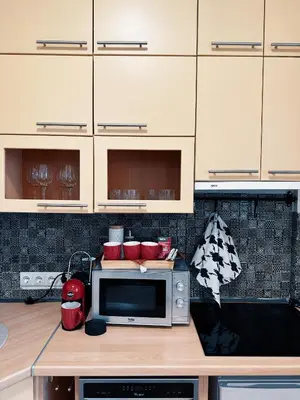 a kitchen with a microwave on a counter at City Center Apartments in Vilnius