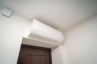 a air conditioner on the ceiling of a room at Oldtown art apartaments in Kaunas