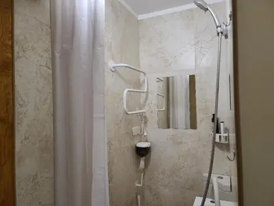 a bathroom with a shower with a shower curtain at Center 04 in Kaunas
