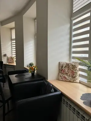 a kitchen with a black sink and a counter at Modern city centre apartment in Vilnius