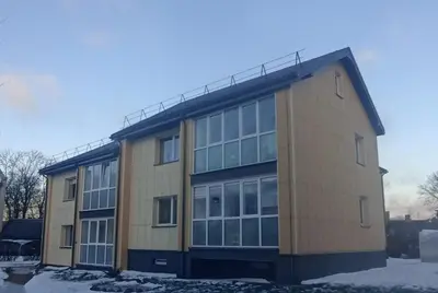 a large building with a lot of windows at Ramūs apartamentai in Anykščiai