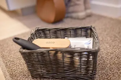a wicker basket with a utensil and a knife at Lukiskes square apartment (Oldtown) in Vilnius