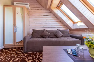 a living room with a couch and a window at Gradiali Anykščiai in Anykščiai