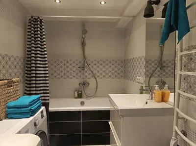 a bathroom with a tub and a sink and a shower at River Vilnele View Studio in Vilnius