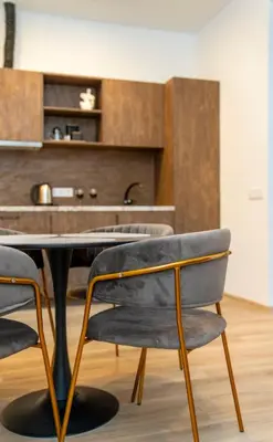 a dining room with a table and chairs at Central Station Apartment No1 in Kaunas