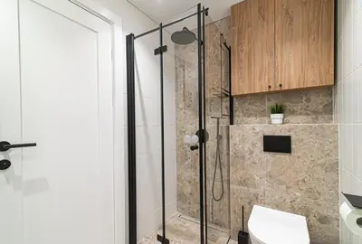 a bathroom with a shower with a glass door at #stayhere - New & Stylish Minimalistic 1BDR Vilnius City Center in Vilnius