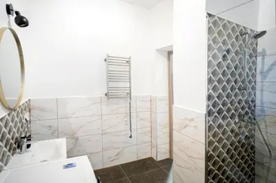 a bathroom with a shower and a toilet at Central Station Apartment No2 in Kaunas