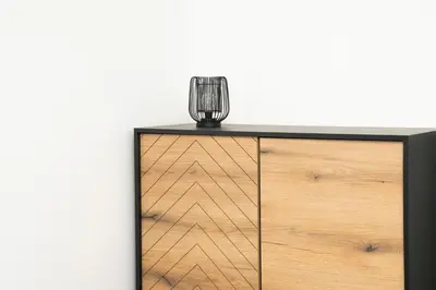 a glass vase on top of a wooden dresser at Central Station Apartment No7 in Kaunas