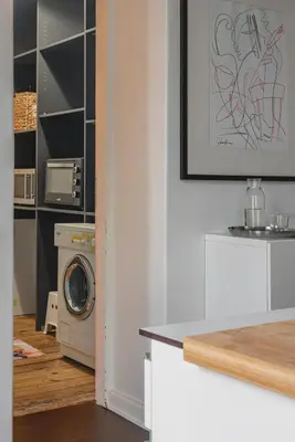 a kitchen with a washer and a washing machine at Apt-Gallery in Central Kaunas in Kaunas