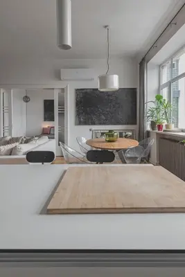 a living room with a table and chairs at Apt-Gallery in Central Kaunas in Kaunas