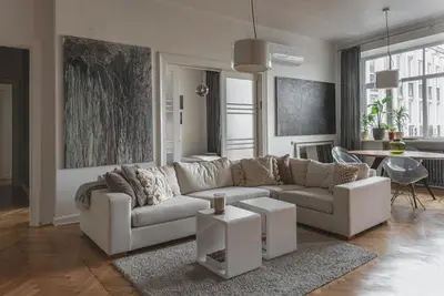 a living room with a couch and a table at Apt-Gallery in Central Kaunas in Kaunas