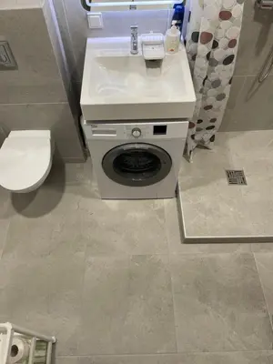 a bathroom with a toilet and a sink at 25 Airport Apartment in Vilnius