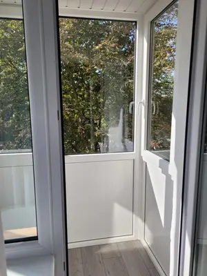 a room with two windows in a house at Maironio apartamentai in Radviliškis