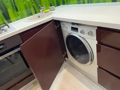a kitchen with a washing machine and a sink at Apartment in Šiauliai in Šiauliai