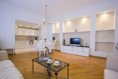 a living room with a couch and a table at Historic Central Apartment in Vilnius