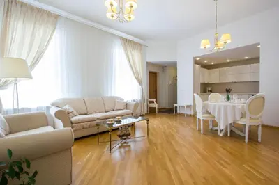 a living room with a couch and a table at Historic Central Apartment in Vilnius