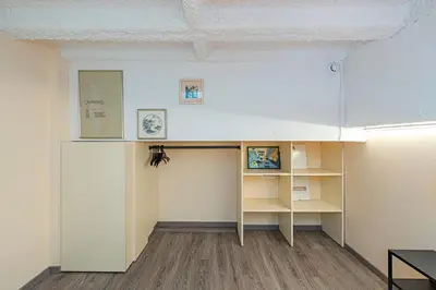 a room with a book shelf and a desk at Modern loft apartment near Christ's Resurrection Church by Polo apartments in Kaunas