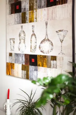 a painting of wine glasses on a wall at #stayhere - Stylish Studio Close to Old Town in Vilnius
