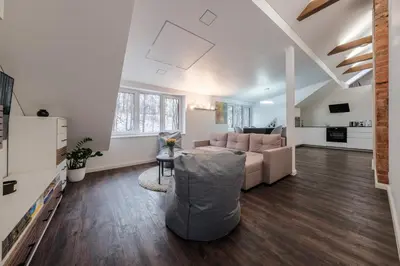 a living room with a couch and a table at Bravo Apartments in Kaunas