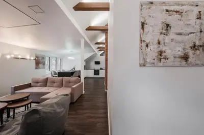 a living room with a couch and a table at Bravo Apartments in Kaunas