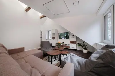 a living room with a couch and a table at Bravo Apartments in Kaunas
