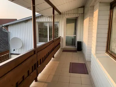 an empty porch of a house with a balcony at Saldus sapnas in Rokiškis