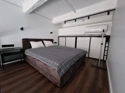 a bedroom with a bed in a room at Radio city loft-468 in Kaunas