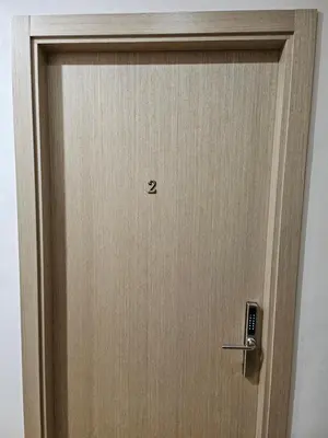 a wooden door with the number two on it at Kauno apartamentai big room king size bed in Kaunas