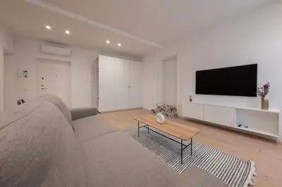 a living room with a couch and a flat screen tv at Downtown getaway apartments by Prime Rentals IV in Kaunas