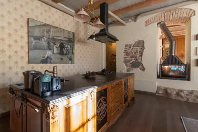 a kitchen with a counter top in a room at Uzupis Angel 3 bedroom Apartment in Vilnius