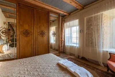 a bedroom with a large bed in a room at Uzupis Angel 3 bedroom Apartment in Vilnius