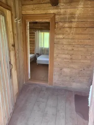 an open door to a room in a house at Šimtametis namelis in Anykščiai