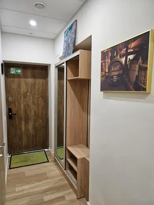 a room with a door and a wall at Kauno Apartamentai su balkonu in Kaunas
