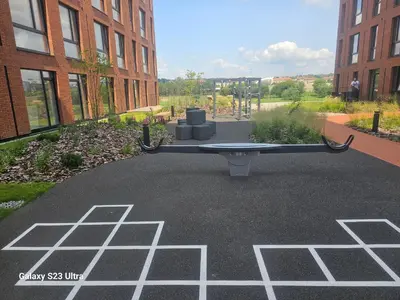 a ping pong table in the middle of a courtyard at Nemunaiciai in Kaunas