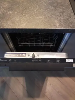 an oven with its door open on top of a counter at Apartments with a balcony and an impressive terrace on the roof of the house in Vilnius